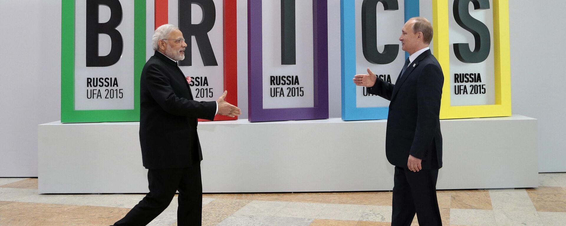 In this July 9, 2015, file photo, Indian Prime Minister Narendra Modi, left, and Russian President Vladimir Putin prepare to shake hands prior to their talks during the BRICS Summit in Ufa, Russia. - Sputnik India, 1920, 11.06.2024