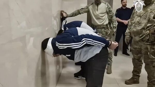 In this photo taken from video released by Investigative Committee of Russia on Sunday, March 24, 2024, suspects in the Crocus City Hall shooting on Friday, stand inside the Russian Investigative Committee headquarters in Moscow, Russia.  - Sputnik भारत