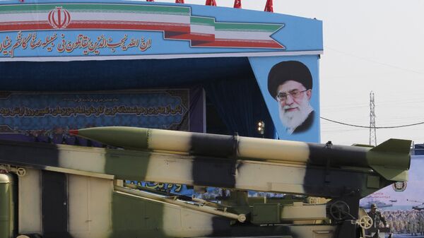 An Iranian military truck carries missiles past a portrait of Iran's Supreme Leader Ayatollah Ali Khamenei during a parade on the occasion of the country's annual army day on April 18, 2018 in Tehran. - Sputnik India