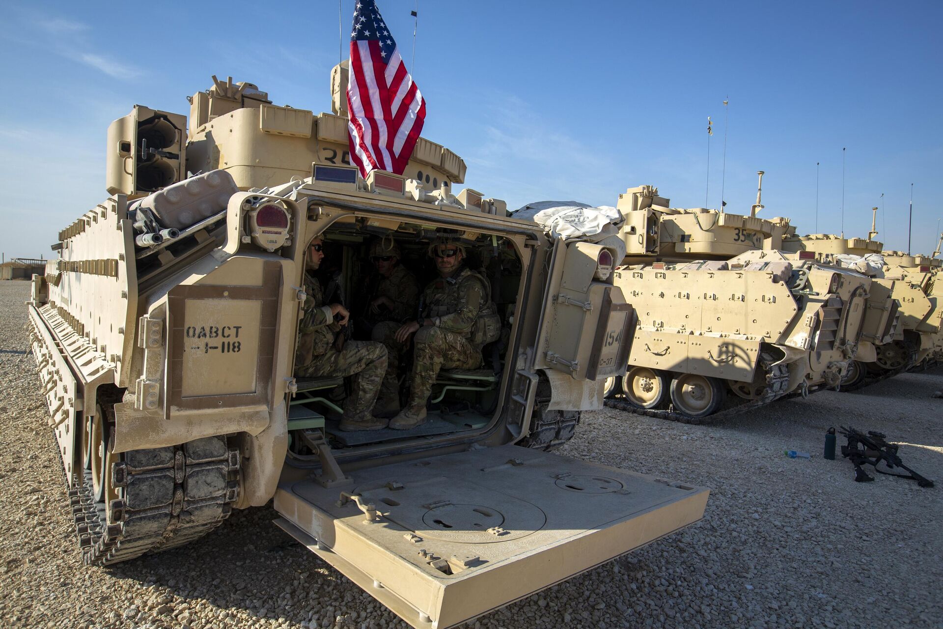 Crewmen sit inside Bradley fighting vehicles at a US military base at an undisclosed location in Northeastern Syria, Monday, Nov. 11, 2019. - Sputnik भारत, 1920, 24.04.2024