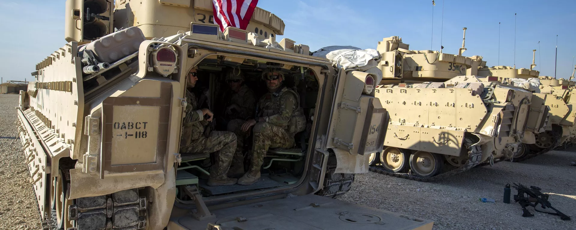 Crewmen sit inside Bradley fighting vehicles at a US military base at an undisclosed location in Northeastern Syria, Monday, Nov. 11, 2019. - Sputnik India, 1920, 29.11.2024