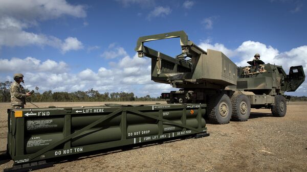 In this image provided by the U.S. Army, U.S. Army Sgt. Ian Ketterling, gunner for Alpha Battery, 1st Battalion, 3rd Field Artillery Regiment, 17th Field Artillery Brigade, prepares the crane for loading the Army Tactical Missile System (ATACMS) on to the High Mobility Artillery Rocket System (HIMARS) in Queensland, Australia, July 26, 2023. U.S. officials say Ukraine for the first time has begun using long-range ballistic missiles, called ATACMS, striking a Russian military airfield in Crimea and Russian troops in another occupied area overnight.  (Sgt. 1st Class Andrew Dickson/U.S. Army via AP) - Sputnik India