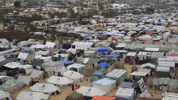 A tent camp housing Palestinians displaced by the Israeli offensive is seen in Rafah, Gaza Strip, Feb. 27, 2024. - Sputnik भारत