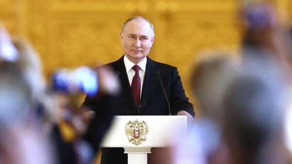 Russian President Vladimir Putin delivers a speech during a meeting with his election campaign agents at the Grand Kremlin Palace - Sputnik India