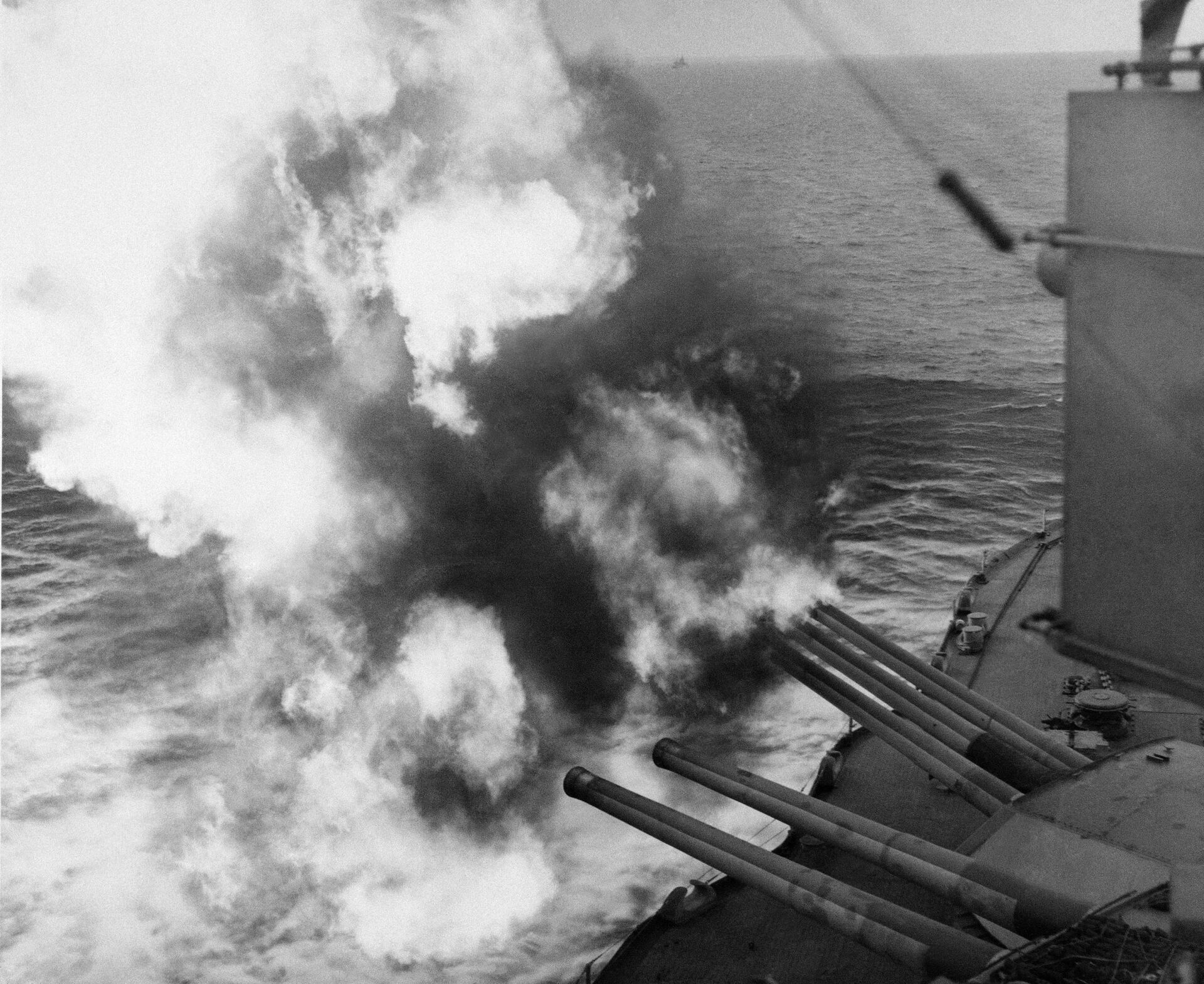 Mushrooms of smoke and flame billow out from the giant USS Nevada as the battleship provides artillery support for Allied ground forces in France by hammering enemy installations from her vantage point in the English Channel, June 6, 1944. - Sputnik India, 1920, 08.05.2024