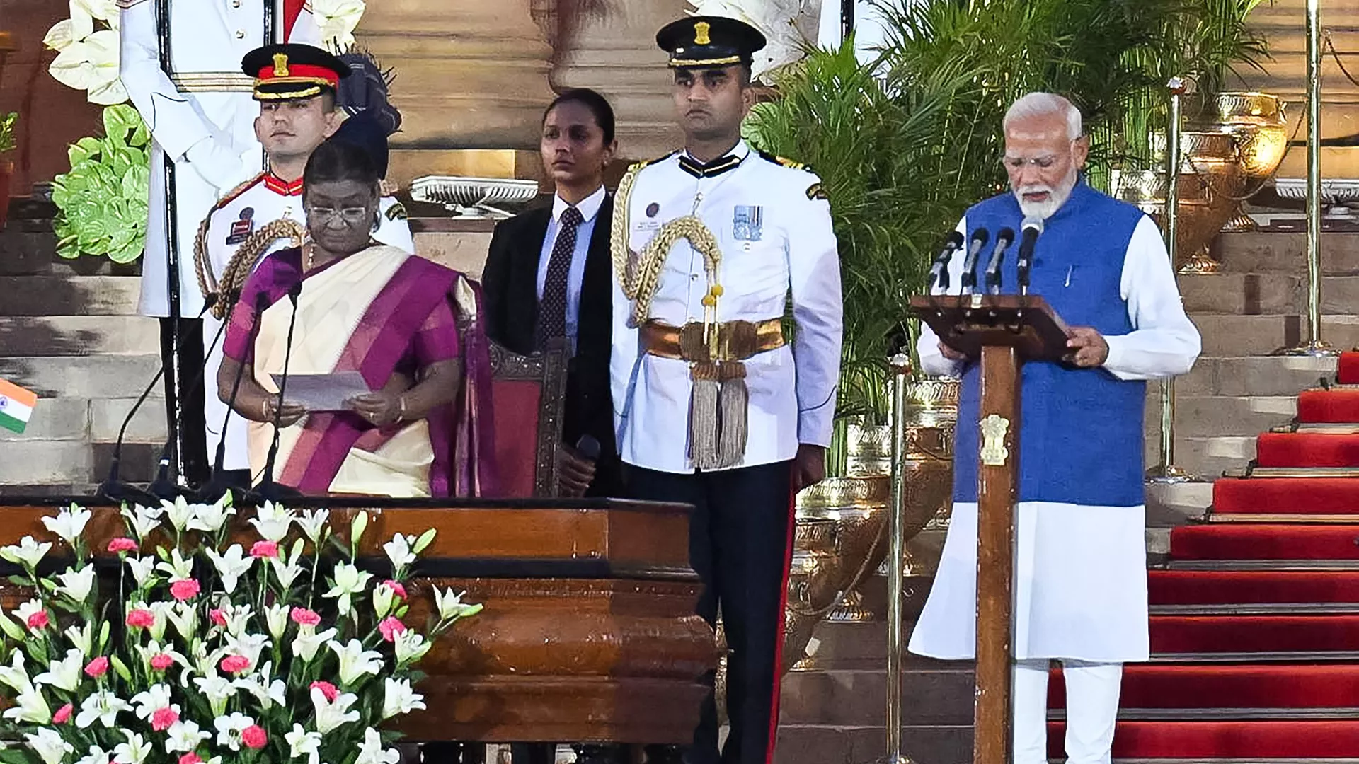 India’s Bharatiya Janata Party (BJP) leader, Narendra Modi (R) takes the oath of office for a third term as the country's Prime Minister during the oath-taking ceremony administered by President Droupadi Murmu (2L) at presidential palace Rashtrapati Bhavan in New Delhi on June 9, 2024.