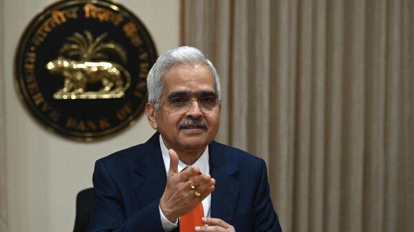 The Reserve Bank of India (RBI) Governor Shaktikanta Das gestures as he arrives to address a press conference at the RBI head office in Mumbai on February 8, 2023. India's central bank slowed the pace of interest rate hikes on February 8 but warned that core inflation in the world's fifth-biggest economy remained stubbornly high. (Photo by Punit PARANJPE / AFP) - Sputnik India