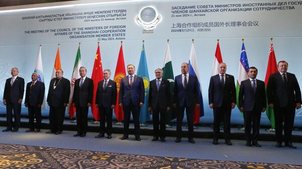 Foreign ministers of the Shanghai Cooperation Organisation (SCO) member states pose for a family photo prior to their meeting in Astana on May 21, 2024. (Photo by STRINGER / AFP)  - Sputnik India