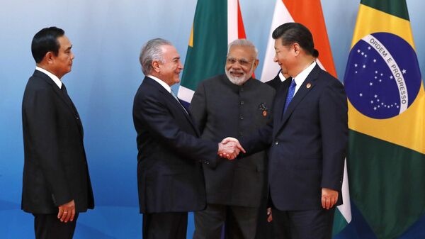 Chinese President Xi Jinping, right, greets Thai Prime Minister Prayuth Chan-ocha, left, Brazilian President Michel Temer, second from left, and Indian Prime Minister Narendra Modi before a group photo of the Emerging Market and Developing Countries meeting at the BRICS Summit, in Xiamen, China, Tuesday, Sept. 5, 2017.  - Sputnik भारत