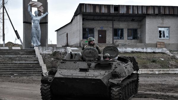 Soldiers of the Ukrainian Army drive a MT-LB vehicle towards the front line near Bakhmut, Donetsk region, on March 11, 2023. - Sputnik भारत