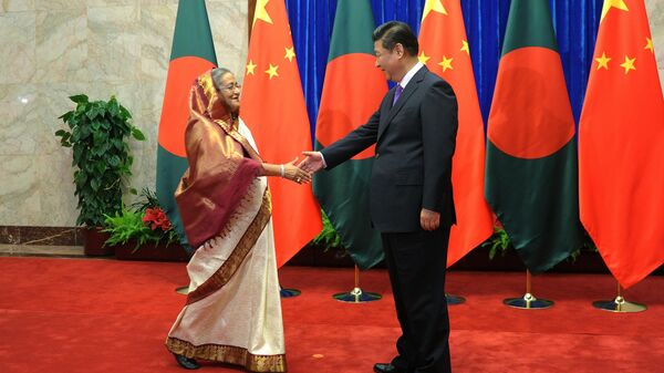Bangladesh Prime Minister Sheikh Hasina, left, is greeted by Chinese President Xi Jinping at the Great Hall of the People in Beijing, China, Tuesday, June 10, 2014. Hasina is on a 6-day visit to China from June 6. (AP Photo/Wang Zhao, Pool)  - Sputnik India