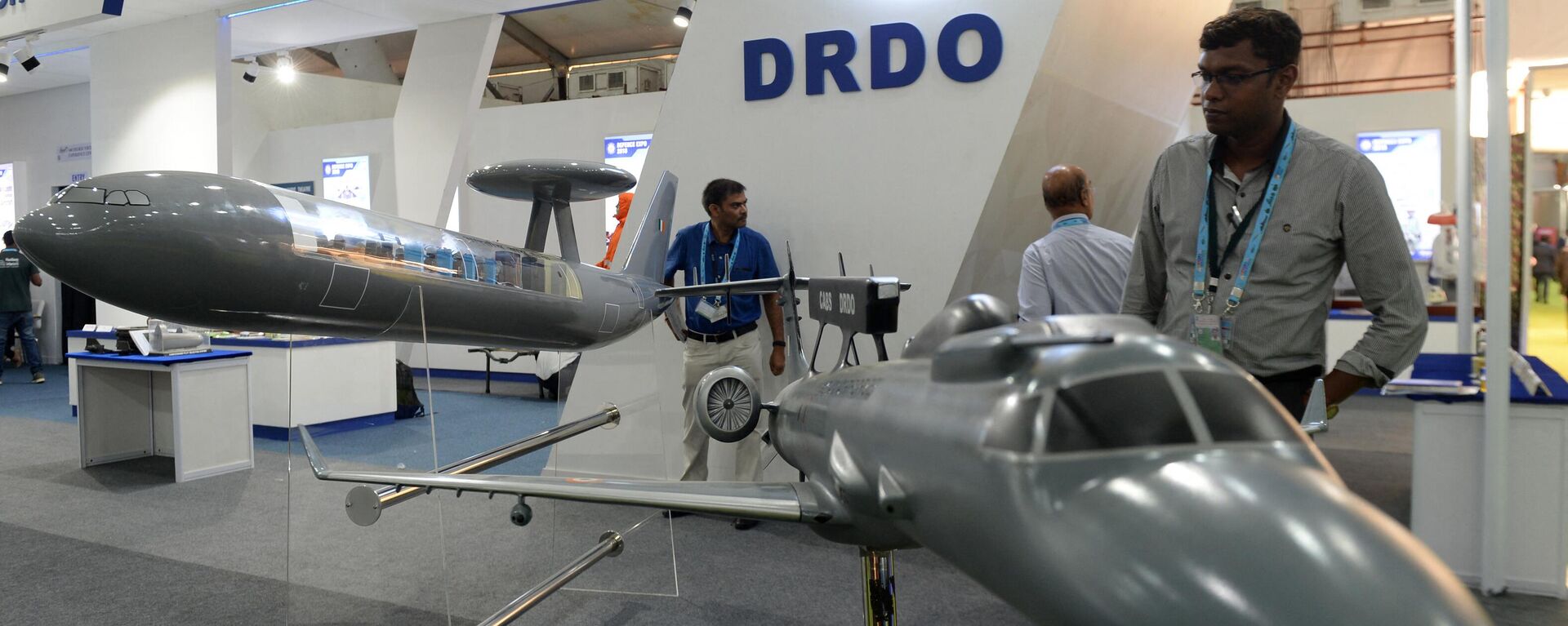 Visitors look at a display of India's Defence Research and Development Organization (DRDO) communication aircraft at the DefExpo 2018, a large defence exhibition showcasing military equipment, on the outskirts of Chennai on April 11, 2018. - Sputnik भारत, 1920, 11.07.2024