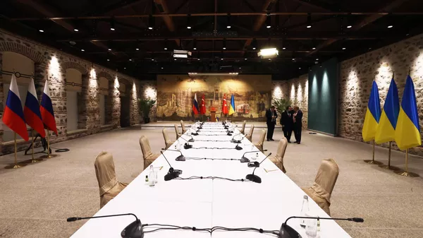 The table at which the Russian-Ukrainian negotiations took place at the Dolmabahce Palace, in Istanbul, Turkiye, in 2022. - Sputnik India