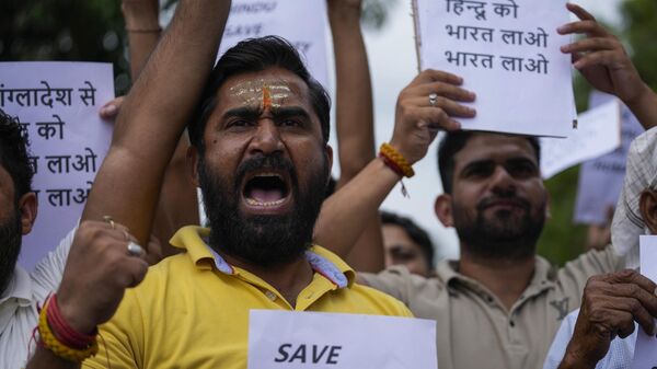 A small group of activists of right-wing Hindu group Shurveer Jammu Sangathan reacting to reports of attacks on Hindu temples and houses of Hindus in Bangladesh, shout slogans during a protest in Jammu, India, Thursday, Aug.8, 2024. - Sputnik India