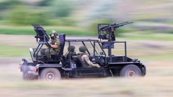 An “anti-drone buggy” being tested by Russian troops inside Ukraine in June 2024. The vehicle sports multiple automatic weapons mounted on a light chassis, and unspecified “anti-drone weapons” are apparently fired from grenade launch tubes seen at the front and rear of the vehicle. - Sputnik India