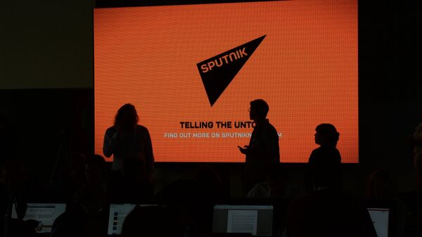 A screen with the logo of the Sputnik international news agency and radio - Sputnik भारत