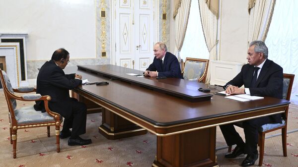 Russian President Vladimir Putin, center, accompanied by Russian Security Council Secretary Sergei Shoigu, right, speaks with Indian National Security Adviser Ajit Doval, left, on the sidelines of the BRICS and BRICS Plus High-Level Security Officials meeting in St. Petersburg, Russia, Thursday, Sept. 12, 2024. - Sputnik भारत