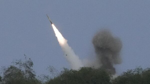 A US M142 High Mobility Artillery Rocket System (HIMARS) fires a missile during a Combined Joint Littoral Live Fire Exercise at the joint military exercise called Balikatan, Tagalog for shoulder-to-shoulder in a Naval station in Zambales province, northern Philippines on Wednesday, April 26, 2023 - Sputnik भारत