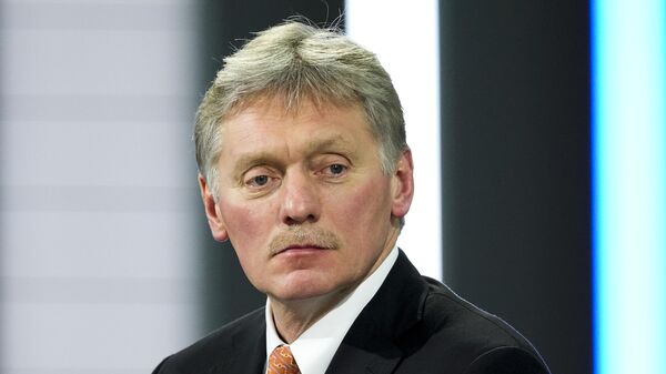 Kremlin spokesman Dmitry Peskov looks at journalists prior to Russian President Vladimir Putin's annual news conference in Moscow, Russia, Thursday, Dec. 23, 2021. - Sputnik India