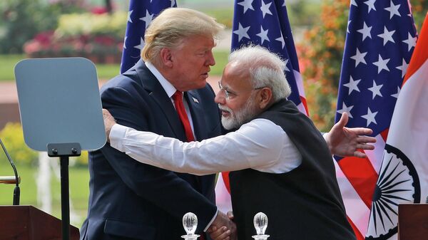 FILE - In this Feb. 25, 2020 file photo, U.S. President Donald Trump and Indian Prime Minister Narendra Modi embrace after giving a joint statement in New Delhi, India - Sputnik भारत