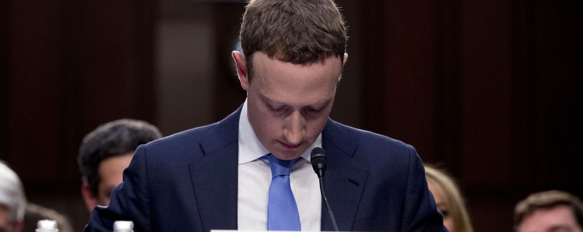 In this April 10, 2018, file photo Facebook CEO Mark Zuckerberg looks down as a break is called during his testimony before a joint hearing of the Commerce and Judiciary Committees on Capitol Hill in Washington. - Sputnik India, 1920, 18.09.2024