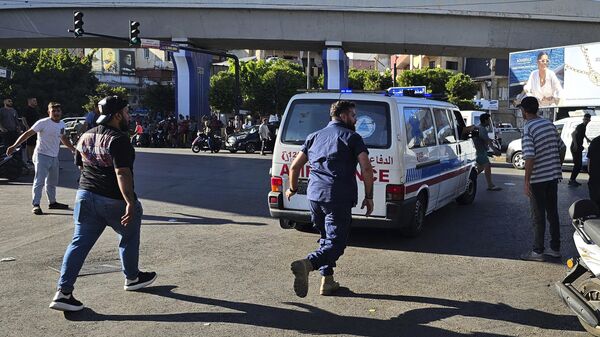 An ambulance carries wounded people whose handheld pager exploded, in Beirut, Lebanon - Sputnik India