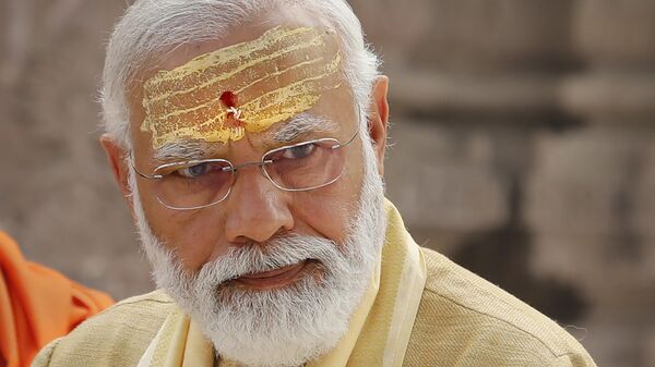 FILE- Indian Prime Minister Narendra Modi during the inauguration of Kashi Vishwanath Dham Corridor, a promenade that connects the sacred Ganges River with the centuries-old temple dedicated to Lord Shiva in Varanasi, India, Monday, Dec. 13, 2021. Popular but polarizing Prime Minister Narendra Modi who has advanced Hindu nationalism in India is returning for a third consecutive term in office after clinching victory in a general election that was seen as a referendum on his decade in power. (AP Photo/Rajesh Kumar Singh,file) - Sputnik India