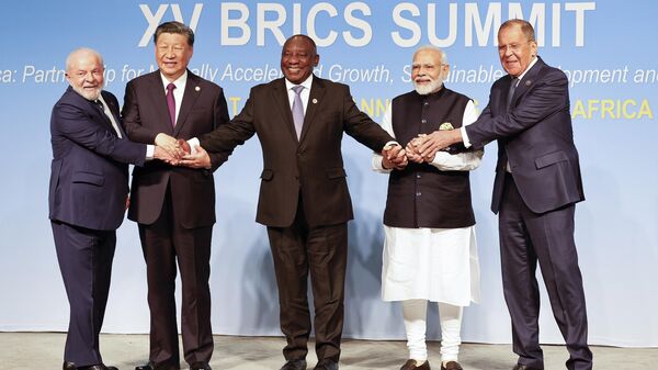 From left, Brazil President Luiz Inacio Lula da Silva, China President Xi Jinping, South African President Cyril Ramaphosa, Prime Minister of India Narendra Modi and Russia's Foreign Minister Sergei Lavrov pose for a BRICS family photo during the 2023 BRICS Summit at the Sandton Convention Centre in Johannesburg, South Africa, Wednesday, Aug. 23, 2023. - Sputnik India