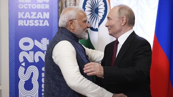 Russian President Vladimir Putin, right, embraces Indian Prime Minister Narendra Modi during their meeting on the sidelines of BRICS Summit at Kazan Kremlin in Kazan, Russia, Tuesday, Oct. 22, 2024. (AP Photo/Alexander Zemlianichenko, Pool) - Sputnik India