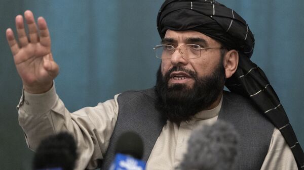 FILE - In this March 19, 2021 file photo, Suhail Shaheen, Afghan Taliban spokesman and a member of the negotiation team gestures while speaking during a joint news conference in Moscow, Russia. In an interview with The Associated Press Thursday, July 22, 2021 - Sputnik India