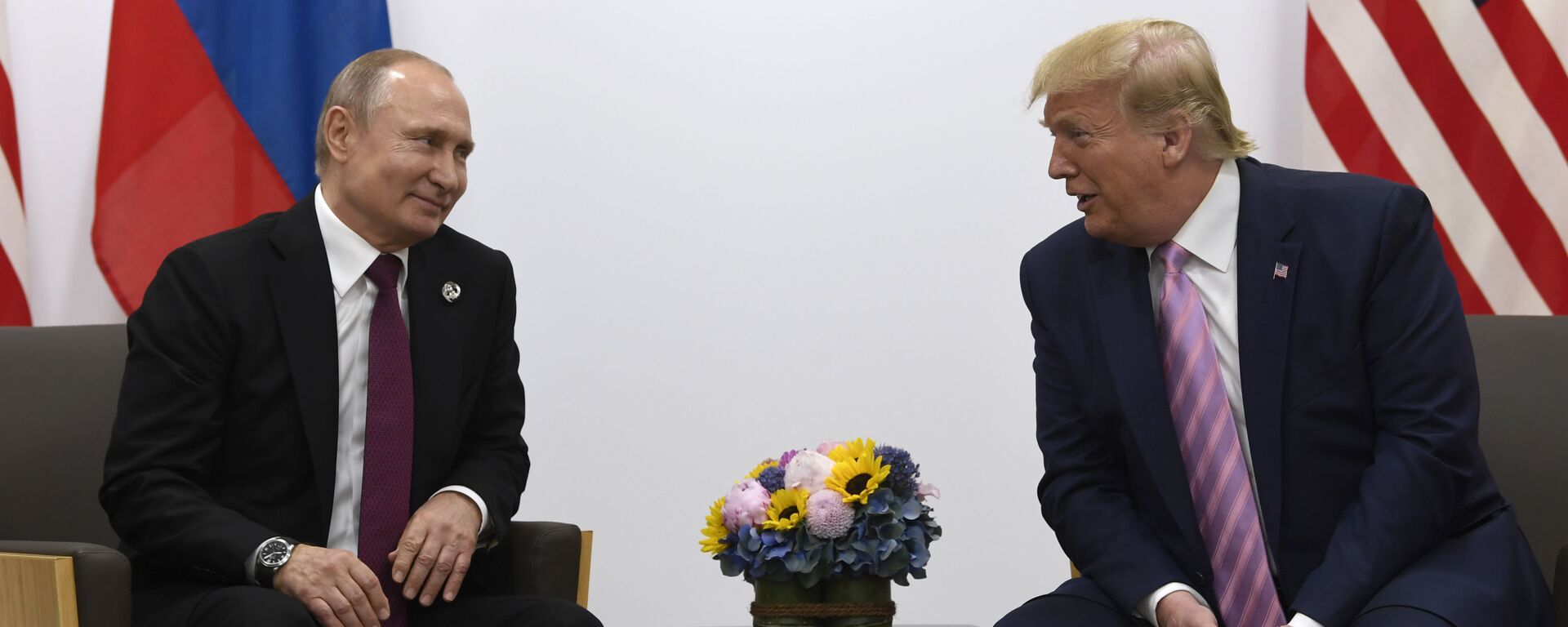  In this June 28, 2019, file photo, President Donald Trump, right, meets with Russian President Vladimir Putin during a bilateral meeting on the sidelines of the G-20 summit in Osaka, Japan. - Sputnik भारत, 1920, 21.02.2025