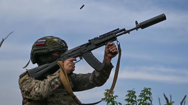A Russian serviceman of the Central military district air defence unit shoots a rifle at an air target in the Avdeyevka area of the frontline of Russia's military operation in Ukraine, Russia - Sputnik India