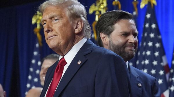 Republican President-Elect Donald Trump and his running mate, Senator JD Vance,  stand on stage at an election night watch party at the Palm Beach Convention Center, Wednesday, Nov. 6, 2024, in West Palm Beach, Florida. - Sputnik भारत