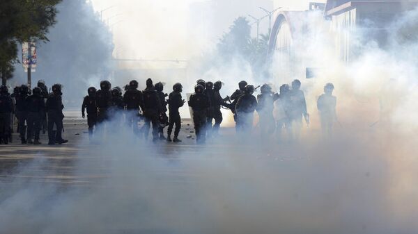 Paramilitary soldiers fire tear gas shells to disperse supporters of imprisoned former premier Imran Khan's Pakistan Tehreek-e-Insaf party, during clashes, in Islamabad, Pakistan, Tuesday, Nov. 26, 2024. - Sputnik India