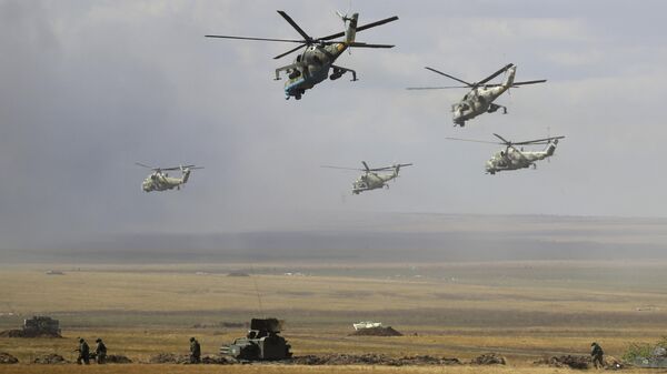 Military helicopters fly over the training ground during strategic command and staff exercises Center-2019 at Donguz shooting range near Orenburg, Russia, Sept. 20, 2019. - Sputnik भारत