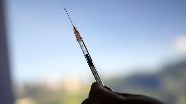 A healthcare worker prepares a dose of the Sputnik V vaccine for COVID-19 as seniors and those considered high risk for contagion are eligible at a vaccination center set up in the parking lot of the Armed Forces Social Prevision Institute (IPSFA) in Caracas, Venezuela, June 7, 2021. - Sputnik India