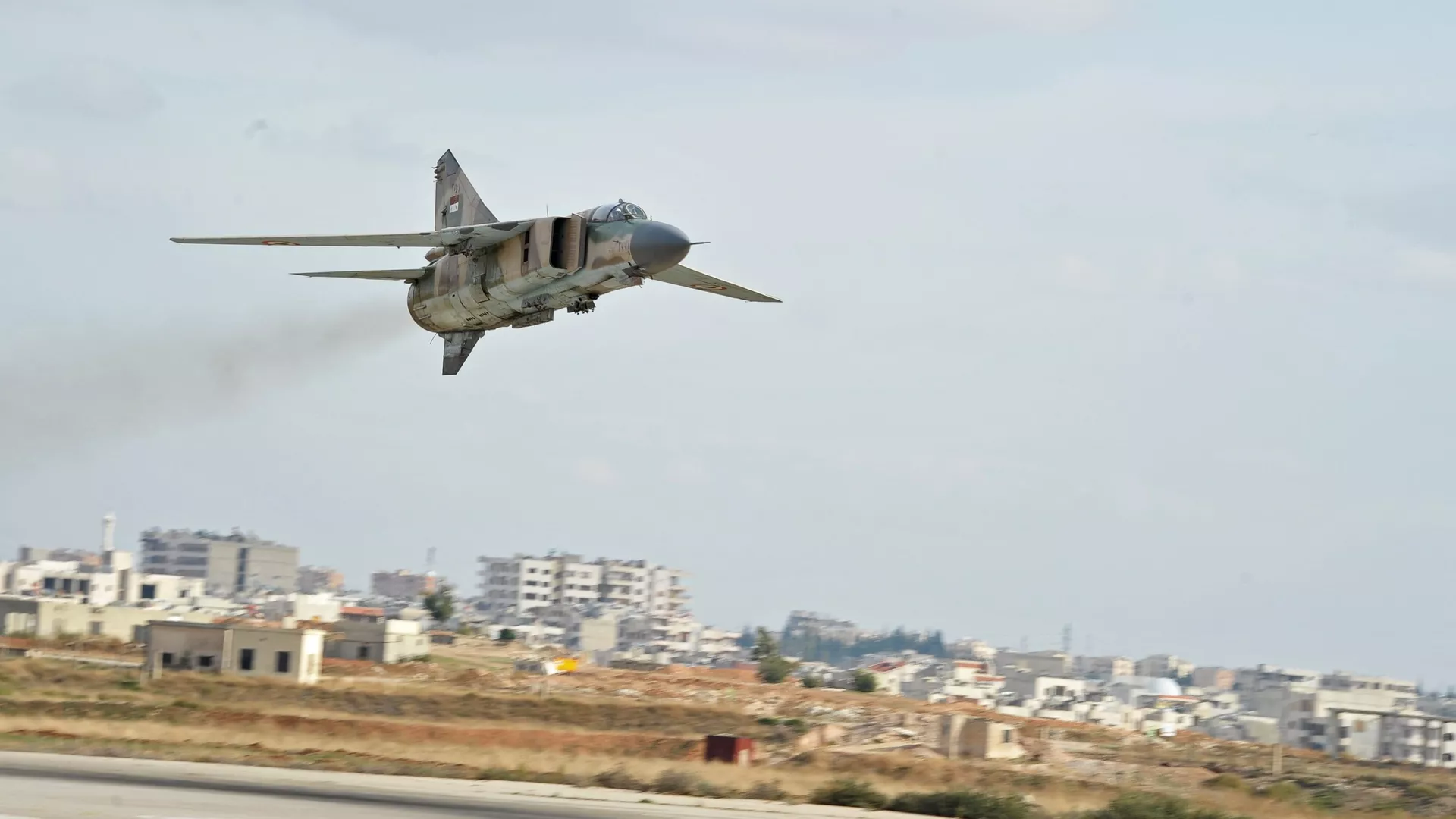 A MiG-23 aircraft of the Syrian Air Force lands at the Hama airbase near the city of Hama, Syria's Hama Province