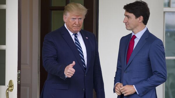 President Donald Trump gives thumbs up as he greets Canadian Prime Minister Justin Trudeau upon his arrival at the White House, Thursday, June 20, 2019, in Washington. (AP Photo/Alex Brandon) - Sputnik India