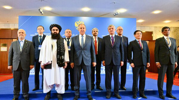 The Ambassador of Iran to Afghanistan, Hassan Kazemi Qumi, acting Foreign Minister of Afghanistan and member of the Taliban leadership, Amir Khan Muttaqi, Russian Foreign Minister Sergey Lavrov, and Russia's Special Representative for Afghanistan Zamir Kabulov (left to right) pose for a group photo during the 6th meeting of the Moscow Format Consultations on Afghanistan. - Sputnik India