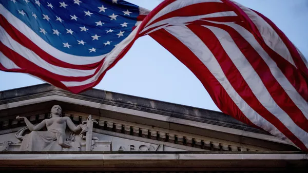 In this March 22, 2019 file photo, an American flag flies outside the Department of Justice in Washington - Sputnik भारत