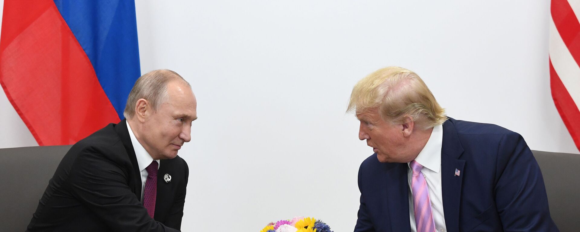 Russian President Vladimir Putin and U.S. President Donald Trump shake hands during a bilateral meeting at the at the Group of 20 (G20) leaders summit in Osaka, Japan. - Sputnik भारत, 1920, 13.01.2025