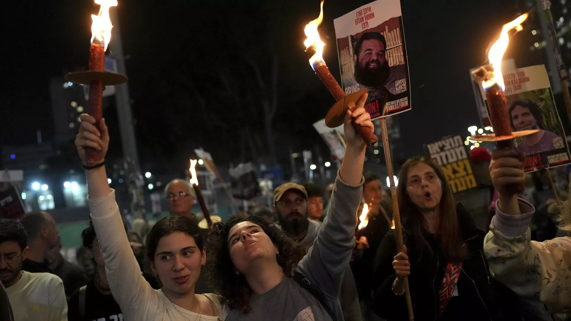 Relatives and friends of people killed and abducted by Hamas and taken into Gaza, react to the ceasefire announcement as they take part in a demonstration in Tel Aviv, Israel, Wednesday, Jan. 15, 2025. 