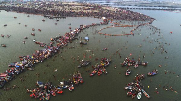 Boats tethered at the Sangam, the confluence of sacred rivers the Yamuna, the Ganges and the mythical Saraswati as devotees take holy dips on the auspicious day of Maha Shivratri during the last day of Kumbh Mela or the Pitcher Festival, in Prayagraj, Uttar Pradesh state, India, Monday, March 4, 2019. The Kumbh Mela is a series of ritual baths by Hindu sadhus, or holy men, and other pilgrims at Sangam that dates back to at least medieval times. Pilgrims bathe in the river believing it cleanses them of their sins and ends their process of reincarnation. (AP Photo/Rajesh Kumar Singh) - Sputnik India