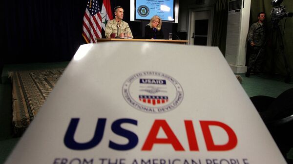 Denise Herbol (C-R), deputy director of the United States Agency for International Development – Iraq (USAID), and Rear Adm. Gregory Smith (L), director of the Multi-National Force-Iraq's Communications Division hold a joint press conference at the heavily fortified Green Zone area in Baghdad, 13 January 2008 - Sputnik India