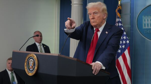 WASHINGTON, DC - JANUARY 30: U.S. President Donald Trump calls on reporters during a press conference about the collision of an American Airlines flight with a military Black Hawk helicopter near Ronald Reagan National Airport, in the Brady Press Briefing Room at the White House on January 30, 2025 in Washington, DC. Officials believe that all 64 people on the commercial jet and the three service members on the U.S. Army helicopter died when they collided midair and crashed into the Potomac River airport outside Washington, D.C. on Wednesday. (Photo by Chip Somodevilla/Getty Images) - Sputnik India