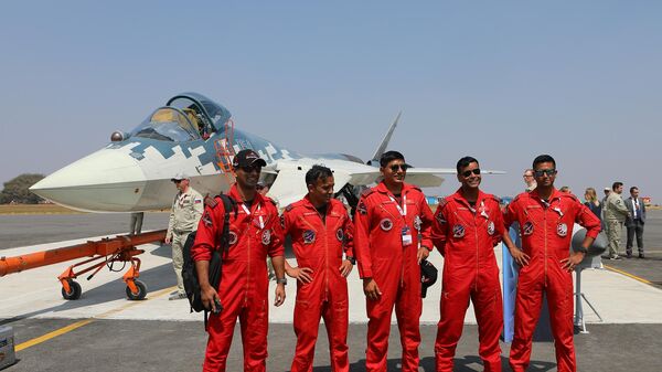 The Indian aerobatic team poses for a photo next to the Russian Su-57 fighter at the XV Aero India 2025 International Aerospace Exhibition, held at the Indian Air Force base in Yelahanka. Nina Padalko / Sputnik - Sputnik India