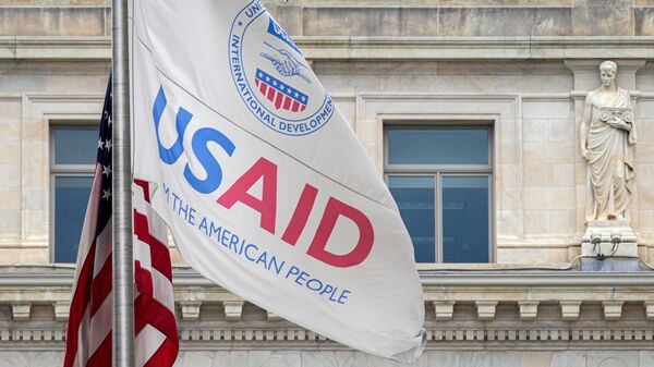 WASHINGTON, DC - JANUARY 30: The US Agency of International Development (USAID) flag flies outside the agency's headquarters building on January 30, 2024, in Washington, DC. (Photo by J. David Ake/Getty Images) - Sputnik India