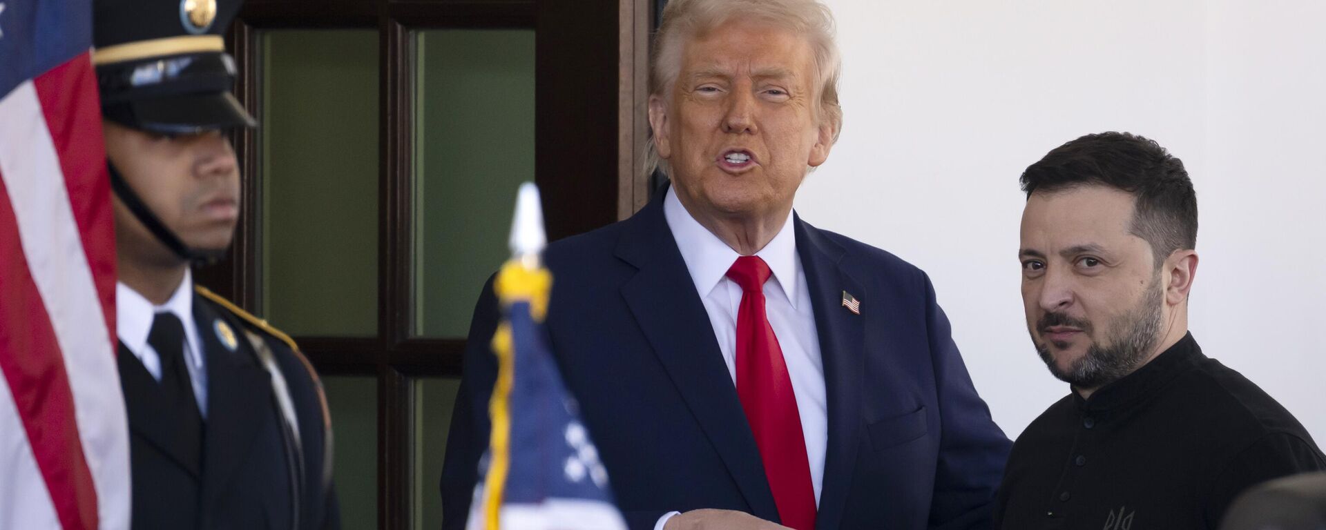 Ukraine's Volodymyr Zelensky, right, is greeted by President Donald Trump, center, as he arrives at the White House in Washington, Friday, Feb. 28, 2025.  - Sputnik भारत, 1920, 01.03.2025