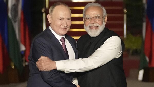 Russian President Vladimir Putin, left, and Indian Prime Minister Narendra Modi greet each other before their meeting in New Delhi, India on Dec. 6, 2021. - Sputnik भारत