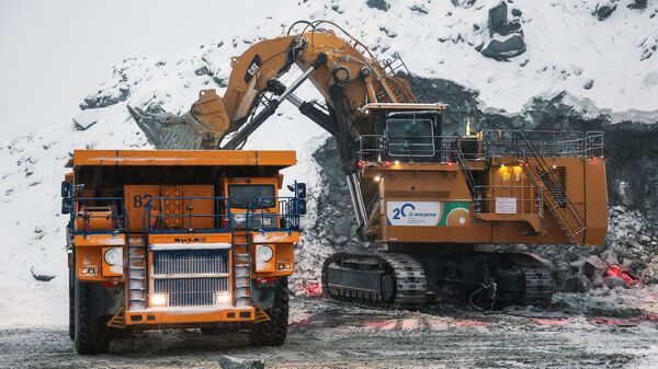 6689026 01.11.2021 A mining dump truck and an excavator at the Eastern mine of Kirovskoye JSC Apatit of the PhosAgro company. PhosAgro is the world’s largest producer of high-quality phosphate raw materials (with P2O5 content of more than 35.7%). Due to its volcanic origin, the ore mined by PhosAgro is rich in phosphorus (P2O5), aluminum (Al2O3), titanium (TiO2), and rare earth elements. Pavel Lvov  - Sputnik India